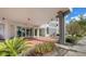 Well-maintained building entrance with brick pavers, manicured landscaping, and modern architectural details at 101 S Gulfstream Ave # 16J, Sarasota, FL 34236