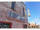 Eclectic restaurant sign on a brick building, advertising live music and local events, and enhancing a vintage vibe at 101 S Gulfstream Ave # 16J, Sarasota, FL 34236
