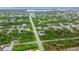 Wide aerial view of neighborhood and streets at 10155 Hallendale Dr, Port Charlotte, FL 33981