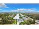 Aerial view of home and neighborhood, showcasing canal at 10155 Hallendale Dr, Port Charlotte, FL 33981
