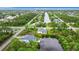 Aerial view showing home, canal, and neighborhood at 10155 Hallendale Dr, Port Charlotte, FL 33981