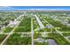 Aerial view of neighborhood, streets, and canal at 10155 Hallendale Dr, Port Charlotte, FL 33981