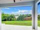 Covered patio overlooking a tranquil lake at 10155 Hallendale Dr, Port Charlotte, FL 33981