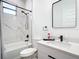 Clean bathroom with white marble tile and modern vanity at 10155 Hallendale Dr, Port Charlotte, FL 33981