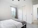 Charming bedroom with a full-size bed and closet at 10155 Hallendale Dr, Port Charlotte, FL 33981