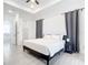 Spacious bedroom with large bed, ensuite bathroom access, and ample closet space at 10155 Hallendale Dr, Port Charlotte, FL 33981