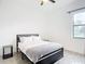 Well-lit bedroom with a double bed and ceiling fan at 10155 Hallendale Dr, Port Charlotte, FL 33981