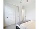 Bedroom with white sliding doors and gray blanket on bed at 10155 Hallendale Dr, Port Charlotte, FL 33981