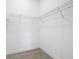 Large walk-in closet with wire shelving for convenient storage at 10155 Hallendale Dr, Port Charlotte, FL 33981