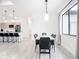 Modern dining room with concrete table and black chairs at 10155 Hallendale Dr, Port Charlotte, FL 33981