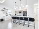 Modern kitchen with white shaker cabinets, quartz countertops, and stainless steel appliances at 10155 Hallendale Dr, Port Charlotte, FL 33981