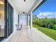 Covered patio with a table and access to backyard at 10155 Hallendale Dr, Port Charlotte, FL 33981