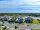 Aerial view of a house with a pool and landscaped yard in a residential neighborhood at 10916 Copperlefe Dr, Bradenton, FL 34212