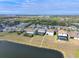 Aerial view of a luxury home with a pool and lakefront lot at 10916 Copperlefe Dr, Bradenton, FL 34212