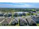 Aerial view of a house with a pool and landscaped yard in a residential neighborhood at 10916 Copperlefe Dr, Bradenton, FL 34212
