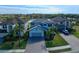 Two-story house with gray siding and paver driveway at 10916 Copperlefe Dr, Bradenton, FL 34212