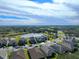 Aerial view of a house with a pool and landscaped yard in a residential neighborhood at 10916 Copperlefe Dr, Bradenton, FL 34212
