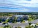 Aerial view of a house with a pool and landscaped yard in a residential neighborhood at 10916 Copperlefe Dr, Bradenton, FL 34212