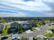 Aerial view of a house with a pool and landscaped yard in a residential neighborhood at 10916 Copperlefe Dr, Bradenton, FL 34212
