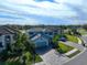 Two-story house with gray siding and paver driveway at 10916 Copperlefe Dr, Bradenton, FL 34212