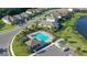 Community pool and surrounding homes, aerial view at 10916 Copperlefe Dr, Bradenton, FL 34212