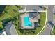 Community pool with lounge chairs and a covered patio at 10916 Copperlefe Dr, Bradenton, FL 34212