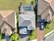 Aerial view of a house with a pool and landscaped yard in a residential neighborhood at 10916 Copperlefe Dr, Bradenton, FL 34212
