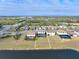 Aerial view of a luxury home with a pool and lakefront lot at 10916 Copperlefe Dr, Bradenton, FL 34212