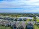 Aerial view of a house with a pool and landscaped yard in a residential neighborhood at 10916 Copperlefe Dr, Bradenton, FL 34212