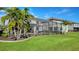 Landscaped backyard with pool and lush lawn at 10916 Copperlefe Dr, Bradenton, FL 34212