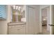 Bathroom boasting granite vanity and a linen closet at 10916 Copperlefe Dr, Bradenton, FL 34212