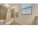 Clean bathroom with tub, shower, and tile flooring at 10916 Copperlefe Dr, Bradenton, FL 34212