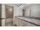 Bathroom with a double vanity and granite countertop at 10916 Copperlefe Dr, Bradenton, FL 34212