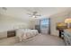Main bedroom with a queen bed and large window at 10916 Copperlefe Dr, Bradenton, FL 34212