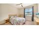 Bright bedroom with a full-size bed, dresser, and window at 10916 Copperlefe Dr, Bradenton, FL 34212