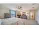 Spacious bedroom with large window, ceiling fan, and ample dresser space at 10916 Copperlefe Dr, Bradenton, FL 34212