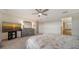 Well-lit bedroom with a dresser and TV stand, offering a relaxing atmosphere at 10916 Copperlefe Dr, Bradenton, FL 34212