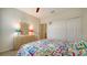 Bedroom with a bed, dresser, and access to hallway at 10916 Copperlefe Dr, Bradenton, FL 34212