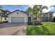 Two-story house with attached garage and landscaping at 10916 Copperlefe Dr, Bradenton, FL 34212