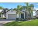 Two-story house with attached garage and landscaping at 10916 Copperlefe Dr, Bradenton, FL 34212