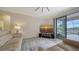 Relaxing living room with sliding doors that open to a lanai and pool at 10916 Copperlefe Dr, Bradenton, FL 34212