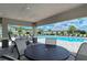 Community pool with patio furniture under a covered structure at 10916 Copperlefe Dr, Bradenton, FL 34212