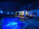 Enclosed pool and spa with lighting and fire pit at 10916 Copperlefe Dr, Bradenton, FL 34212