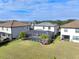 Luxury home's backyard oasis features a screened pool and lanai at 10916 Copperlefe Dr, Bradenton, FL 34212