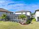 Luxury home's backyard oasis features a screened pool and lanai at 10916 Copperlefe Dr, Bradenton, FL 34212