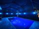 Screened pool and spa with colorful night lighting at 10916 Copperlefe Dr, Bradenton, FL 34212