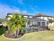 Luxury home's backyard oasis features a screened pool and lanai at 10916 Copperlefe Dr, Bradenton, FL 34212