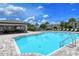 Community pool and covered patio with seating at 10916 Copperlefe Dr, Bradenton, FL 34212