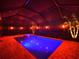 Screened pool and spa with colorful night lighting at 10916 Copperlefe Dr, Bradenton, FL 34212
