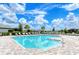 Relaxing community pool with a covered patio and lounge chairs at 10916 Copperlefe Dr, Bradenton, FL 34212